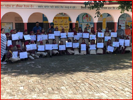 Students with their Drawings.PNG